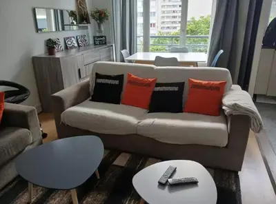 Coin salon dans l'établissement Appartement cosy à 2 mins de Paris