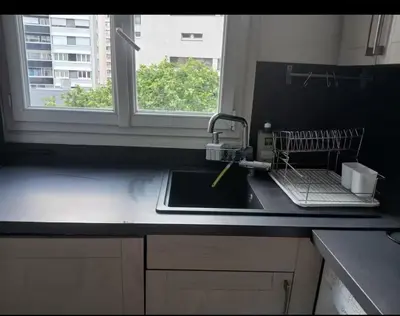 Cuisine ou kitchenette dans l'établissement Appartement cosy à 2 mins de Paris