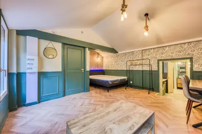 Un ou plusieurs lits dans un hébergement de l'établissement Elegant studios in Malakoff next to Paris
