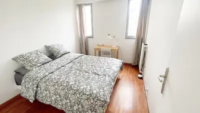 Un ou plusieurs lits dans un hébergement de l'établissement Apartment La Seine-Free Parking