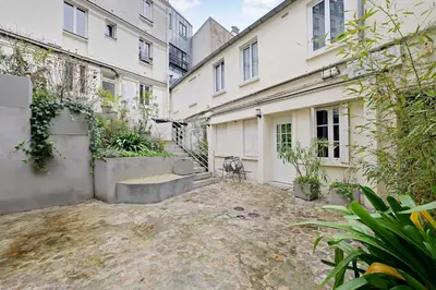 Jardin de l'établissement Cozy Studio 2P – Montmartre