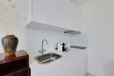 Cuisine ou kitchenette dans l'établissement Cozy Studio 2P – Montmartre