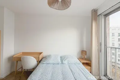 Un ou plusieurs lits dans un hébergement de l'établissement Spacious T7 in Paris 20