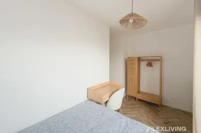 Un ou plusieurs lits dans un hébergement de l'établissement Spacious T7 in Paris 20