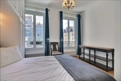 Un ou plusieurs lits dans un hébergement de l'établissement Furnished 3 Bedrooms - 68m2 - M Sablons