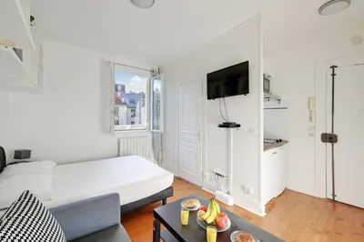 Un ou plusieurs lits dans un hébergement de l'établissement Elegant Studio 2P – Paris 14