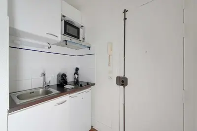 Cuisine ou kitchenette dans l'établissement Elegant Studio 2P – Paris 14