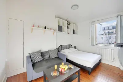 Un ou plusieurs lits dans un hébergement de l'établissement Elegant Studio 2P – Paris 14