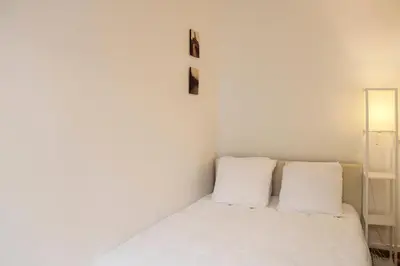 Un ou plusieurs lits dans un hébergement de l'établissement Bel appartement - Bastille Canal Saint Martin