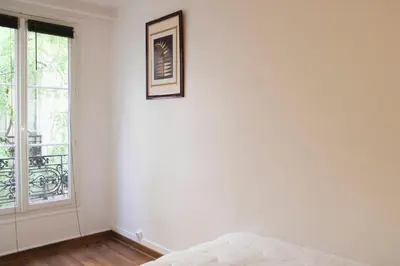 Un ou plusieurs lits dans un hébergement de l'établissement Bel appartement - Bastille Canal Saint Martin
