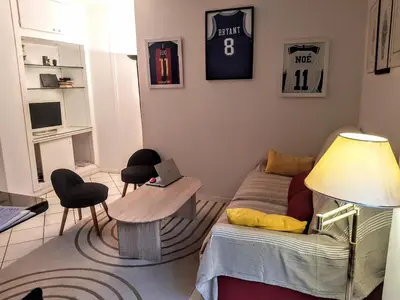 Coin salon dans l'établissement Charming apartment - Eiffel Tower