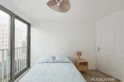 Un ou plusieurs lits dans un hébergement de l'établissement Modern room in T7 in Paris 20