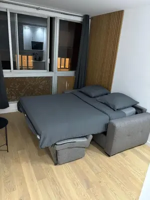 Coin salon dans l'établissement Bright Apartment in Paris Convention and Paris Expo