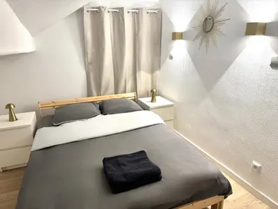 Un ou plusieurs lits dans un hébergement de l'établissement Incroyable appartement Paris Montparnasse
