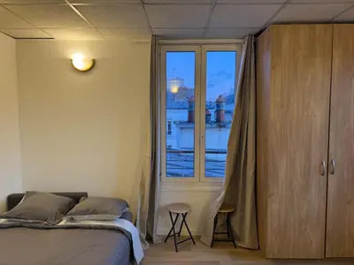 Un ou plusieurs lits dans un hébergement de l'établissement Incroyable appartement Paris Montparnasse