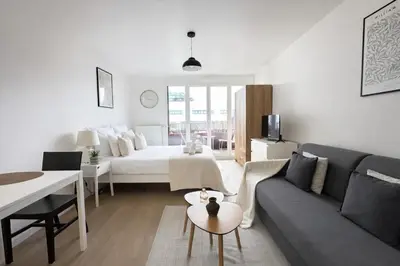 Un ou plusieurs lits dans un hébergement de l'établissement Magnifique Studio au bord de la Seine