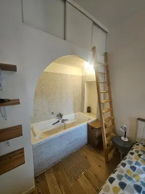 Un ou plusieurs lits dans un hébergement de l'établissement appartement aux portes de Paris