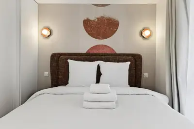 Un ou plusieurs lits dans un hébergement de l'établissement 31 Flat 8 person St Lazare Galerie LaFayette Paris 8th