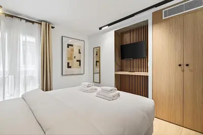 Un ou plusieurs lits dans un hébergement de l'établissement 31 Flat 8 person St Lazare Galerie LaFayette Paris 8th