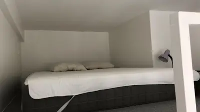 Un ou plusieurs lits dans un hébergement de l'établissement Charmante chambre dans le Marais