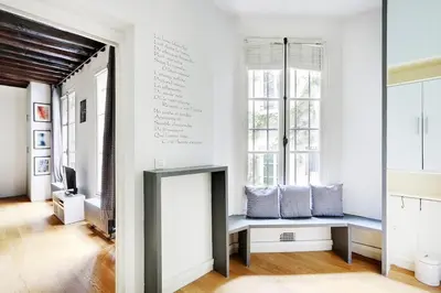 Un ou plusieurs lits dans un hébergement de l'établissement Charming apartment-Saintonge