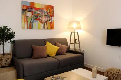 Coin salon dans l'établissement Charmant appartement près de lOpéra et métro