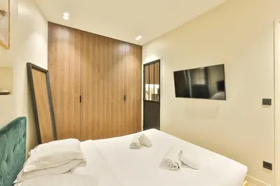 Un ou plusieurs lits dans un hébergement de l'établissement Wonderful Appartment 4p 1 BR Nation Bastille