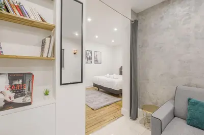 Un ou plusieurs lits dans un hébergement de l'établissement Cozy 4P apartment Place des Vosges Metro St Paul