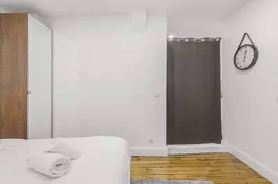 Un ou plusieurs lits dans un hébergement de l'établissement Cozy 4P apartment Place des Vosges Metro St Paul