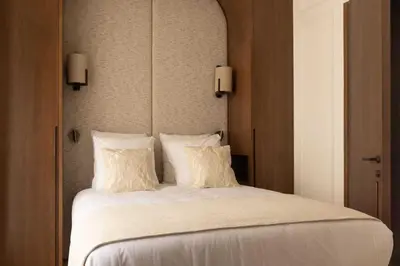 Un ou plusieurs lits dans un hébergement de l'établissement Wagram 85 - Luxury Apartments