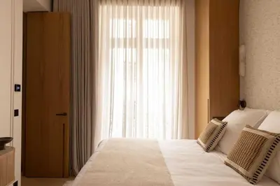 Un ou plusieurs lits dans un hébergement de l'établissement Wagram 85 - Luxury Apartments