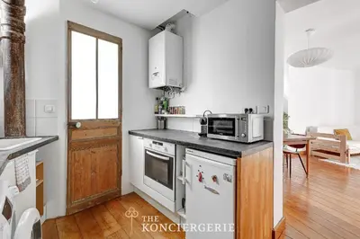 Cuisine ou kitchenette dans l'établissement Charmant 2 pieces lumineux au coeur du 11eme