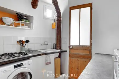 Cuisine ou kitchenette dans l'établissement Charmant 2 pieces lumineux au coeur du 11eme