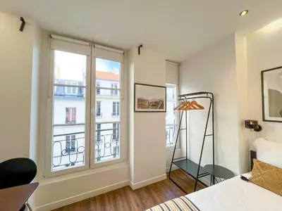 Un ou plusieurs lits dans un hébergement de l'établissement UrbanFlat 208 - Beautiful Studio in the center of Paris