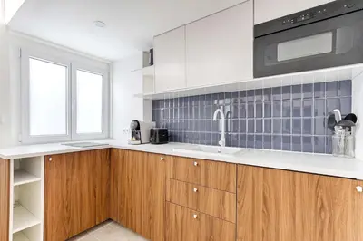 Cuisine ou kitchenette dans l'établissement Chapelle Ordener Cosy Apartment Mezzanine 4P
