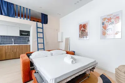 Un ou plusieurs lits dans un hébergement de l'établissement Chapelle Ordener Cosy Apartment Mezzanine 4P