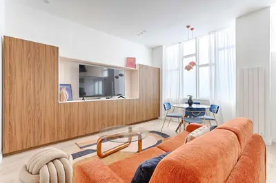 Coin salon dans l'établissement Chapelle Ordener Cosy Apartment Mezzanine 4P