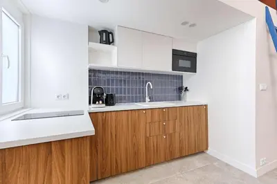 Cuisine ou kitchenette dans l'établissement Chapelle Ordener Cosy Apartment Mezzanine 4P