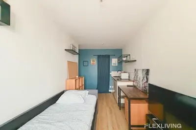 Un ou plusieurs lits dans un hébergement de l'établissement Mignon studio dans Paris 18ème