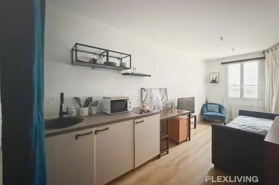 Cuisine ou kitchenette dans l'établissement Mignon studio dans Paris 18ème