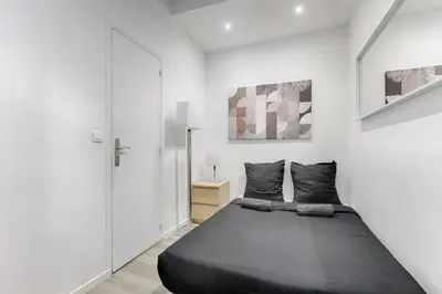 Un ou plusieurs lits dans un hébergement de l'établissement Appartement Cosy Gare de Lyon