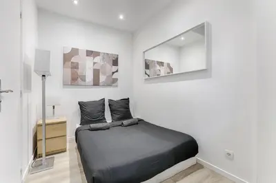 Un ou plusieurs lits dans un hébergement de l'établissement Appartement Cosy Gare de Lyon