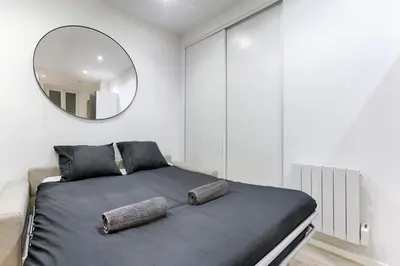 Un ou plusieurs lits dans un hébergement de l'établissement Appartement Cosy Gare de Lyon
