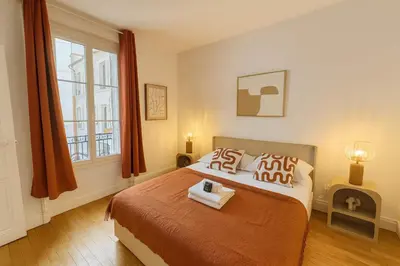 Un ou plusieurs lits dans un hébergement de l'établissement Paris 18 - Sejour Cosy 2 Pieces Proche Metro
