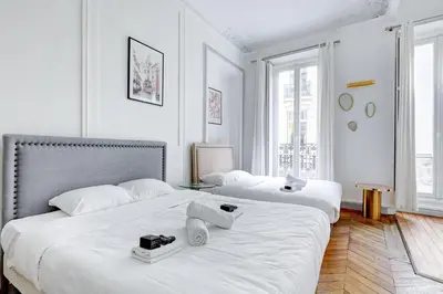 Un ou plusieurs lits dans un hébergement de l'établissement Prestige Parisien Avenue des Champs-Elysees