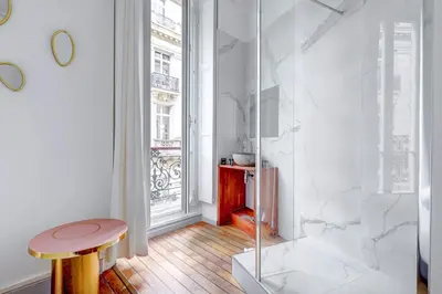 Un ou plusieurs lits dans un hébergement de l'établissement Prestige Parisien Avenue des Champs-Elysees