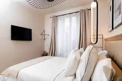 Un ou plusieurs lits dans un hébergement de l'établissement Paris Expo Charm, 52m2, Couples&Business Friendly, 5mn walk to Expo Center Porte de Versailles