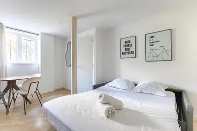 Un ou plusieurs lits dans un hébergement de l'établissement Charming apartment La Chapelle