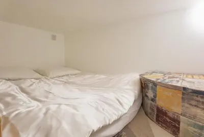 Un ou plusieurs lits dans un hébergement de l'établissement Bright Studio near Parc de la Villette & Metro