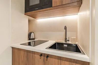 Cuisine ou kitchenette dans l'établissement Le Confidentiel - La Fayette